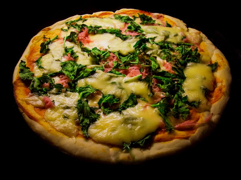 Mediterranean thin crust pizza with olives and feta